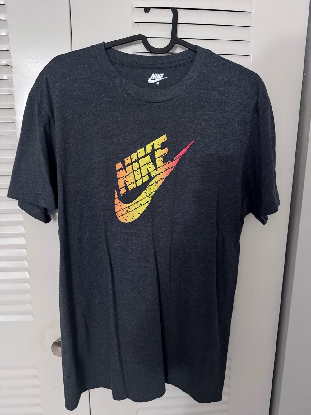 Nike Dark Gray Short-Sleeve Tee with Yellow-Orange Nike Symbol